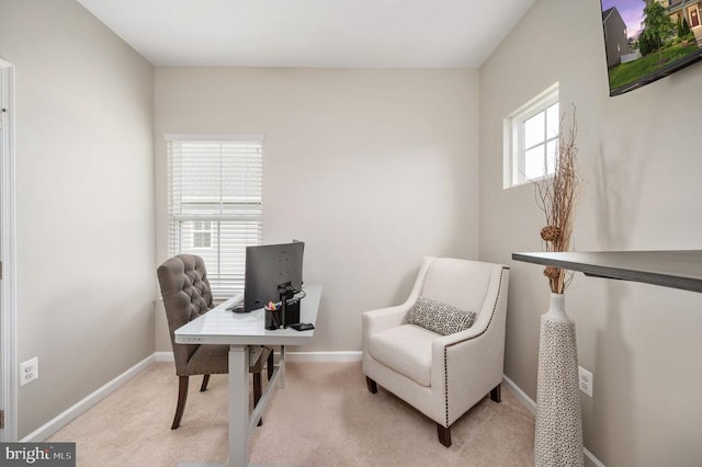 carpeted home office with baseboards