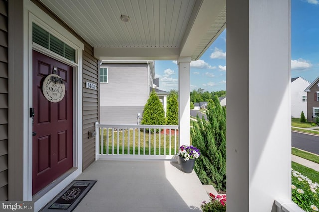 doorway to property featuring a porch