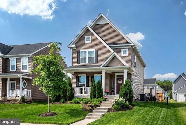 traditional home featuring a porch, central AC, and a front lawn