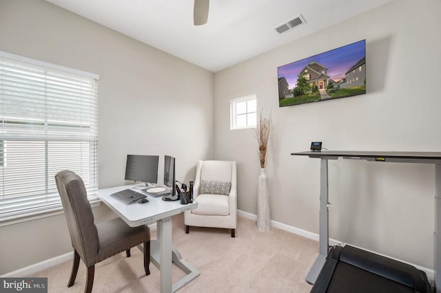 office with light colored carpet, ceiling fan, and baseboards
