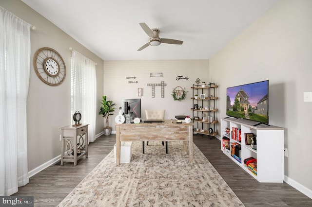 home office featuring a ceiling fan, dark wood-style floors, and baseboards