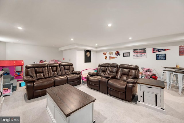 living area featuring light colored carpet and recessed lighting
