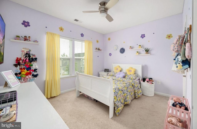 bedroom with light carpet, baseboards, and ceiling fan