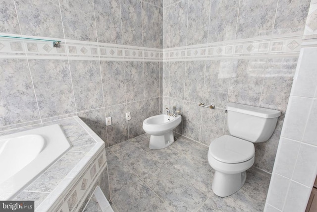 3714 Fairways Ct, Fredericksburg, VA 22408 - full bathroom with tile walls, a bidet, a relaxing tiled tub, and tile patterned floors