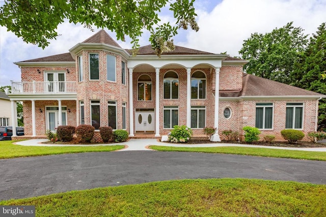 3714 Fairways Ct, Fredericksburg, VA 22408 - view of front of property with a balcony, french doors, brick siding, and a front lawn