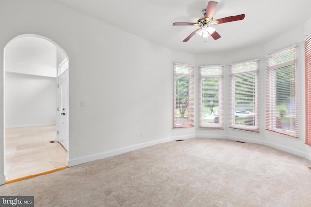 3714 Fairways Ct, Fredericksburg, VA 22408 - spare room with healthy amount of natural light, light colored carpet, ceiling fan, and arched walkways