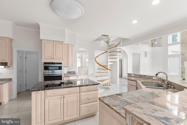 3714 Fairways Ct, Fredericksburg, VA 22408 - kitchen featuring double oven, a kitchen island, arched walkways, ornamental molding, and light tile patterned floors