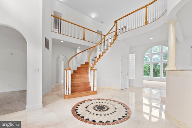 3714 Fairways Ct, Fredericksburg, VA 22408 - entryway with arched walkways, a high ceiling, decorative columns, stairs, and recessed lighting