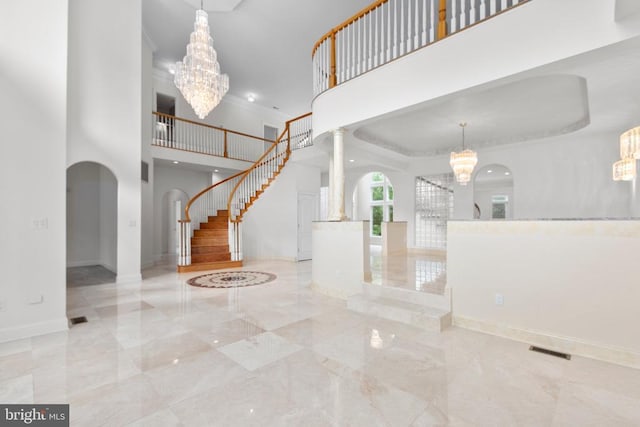 3714 Fairways Ct, Fredericksburg, VA 22408 - foyer entrance featuring a chandelier, a towering ceiling, marble tiled floors, stairs, and ornamental molding