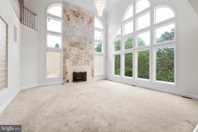 3714 Fairways Ct, Fredericksburg, VA 22408 - unfurnished living room featuring a towering ceiling, carpet floors, healthy amount of natural light, a premium fireplace, and crown molding