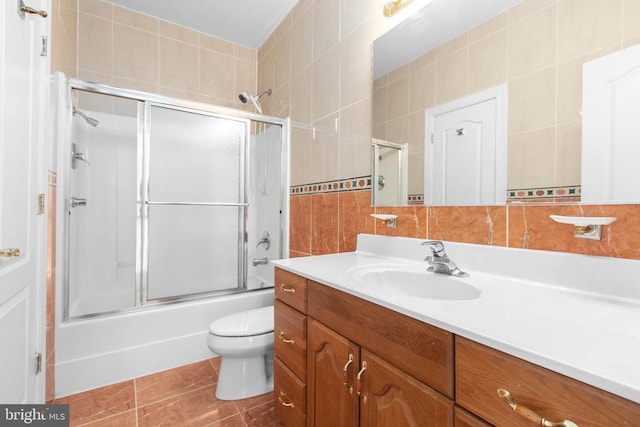 3714 Fairways Ct, Fredericksburg, VA 22408 - full bath with tile walls, vanity, enclosed tub / shower combo, and tile patterned floors