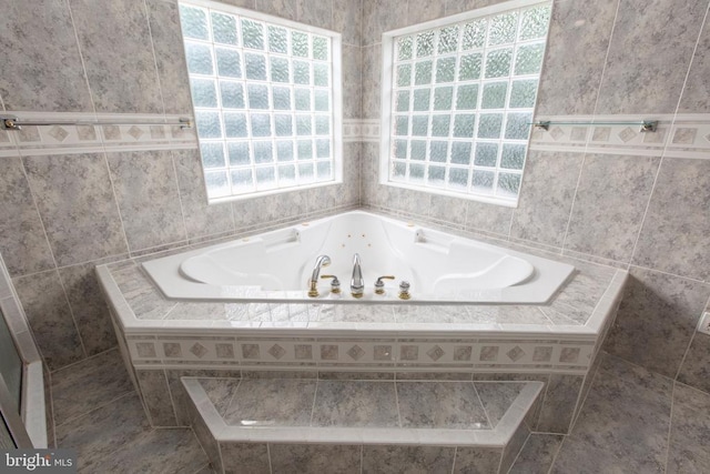3714 Fairways Ct, Fredericksburg, VA 22408 - bathroom featuring a whirlpool tub and tile walls