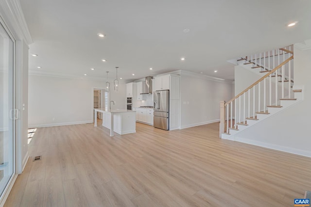 36 Mary Jackson Ct, Charlottesville, VA 22902 - unfurnished living room featuring crown molding, a sink, baseboards, light wood finished floors, and recessed lighting