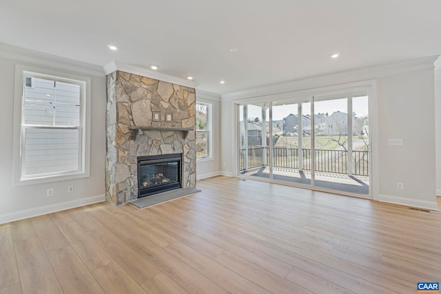36 Mary Jackson Ct, Charlottesville, VA 22902 - unfurnished living room with ornamental molding, baseboards, a stone fireplace, light wood finished floors, and recessed lighting