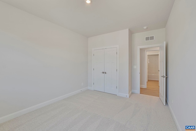 36 Mary Jackson Ct, Charlottesville, VA 22902 - unfurnished bedroom featuring baseboards, light carpet, and a closet