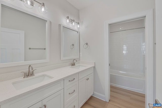 36 Mary Jackson Ct, Charlottesville, VA 22902 - full bath featuring wood finished floors, double vanity, baseboards, and shower / tub combination
