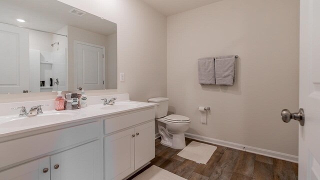306 Coyote Run, Broadway, VA 22815 - full bath with double vanity, toilet, wood finished floors, and baseboards