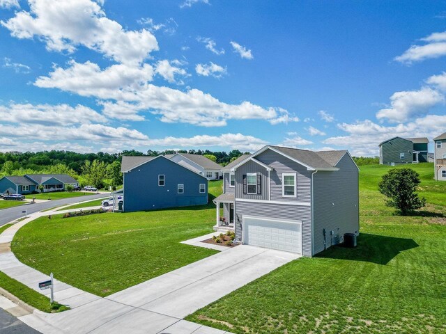306 Coyote Run, Broadway, VA 22815 - view of front facade featuring an attached garage, concrete driveway, a front lawn, and a residential view