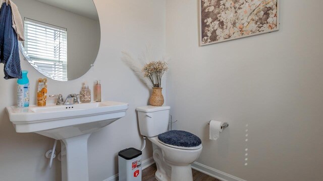 306 Coyote Run, Broadway, VA 22815 - bathroom featuring toilet, baseboards, and wood finished floors