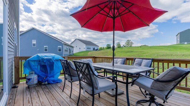 306 Coyote Run, Broadway, VA 22815 - wooden deck with outdoor dining area, a yard, and area for grilling