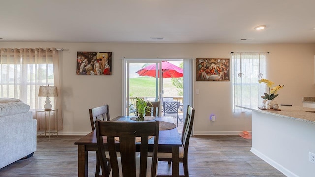 306 Coyote Run, Broadway, VA 22815 - dining room featuring healthy amount of natural light, wood finished floors, baseboards, and recessed lighting
