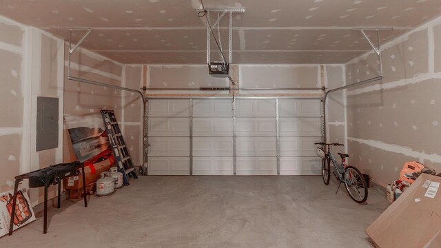 306 Coyote Run, Broadway, VA 22815 - garage featuring a garage door opener and electric panel