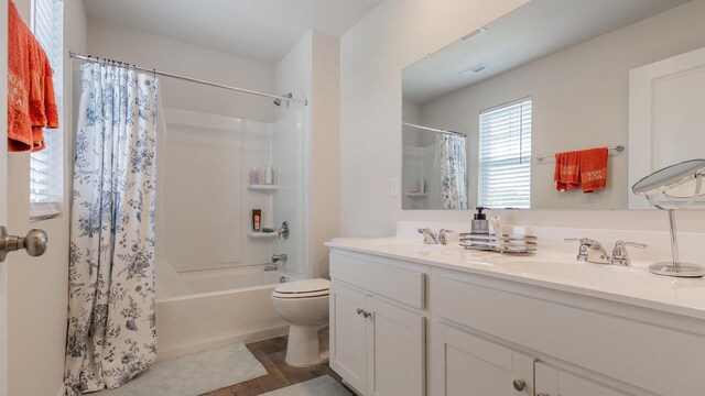 306 Coyote Run, Broadway, VA 22815 - full bath with double vanity, toilet, shower / bath combination with curtain, and wood finished floors