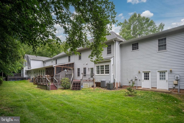 3910 Corbin Hall Ln, Fredericksburg, VA 22408 - rear view of property with a wooden deck, a lawn, and a sunroom
