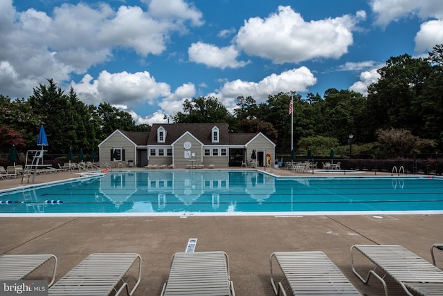 3910 Corbin Hall Ln, Fredericksburg, VA 22408 - community pool with a patio area and view of wooded area