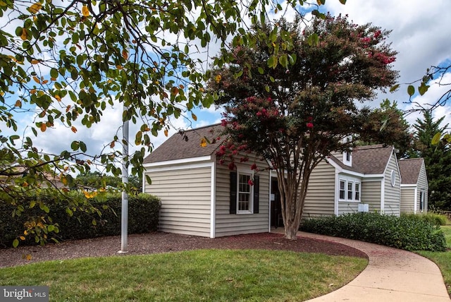 3910 Corbin Hall Ln, Fredericksburg, VA 22408 - view of side of property with a lawn, a shingled roof, and an outdoor structure