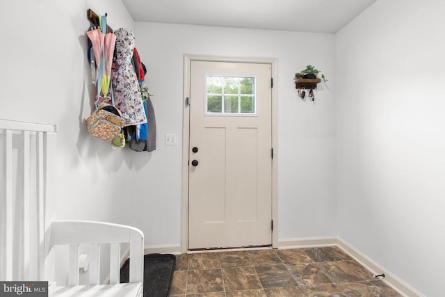 2422 Drake Ln, Fredericksburg, VA 22408 - foyer entrance featuring baseboards and dark stone finish floors