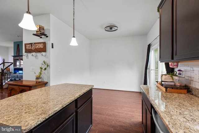2422 Drake Ln, Fredericksburg, VA 22408 - kitchen featuring dark wood-style floors, light stone counters, hanging light fixtures, and dark brown cabinetry