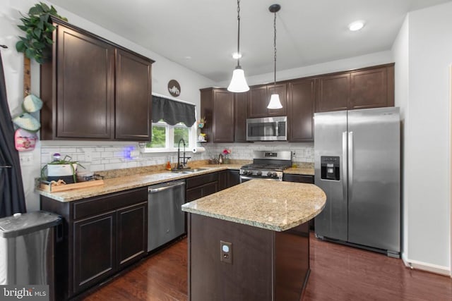 2422 Drake Ln, Fredericksburg, VA 22408 - kitchen featuring appliances with stainless steel finishes, a sink, dark brown cabinets, decorative backsplash, and light stone countertops