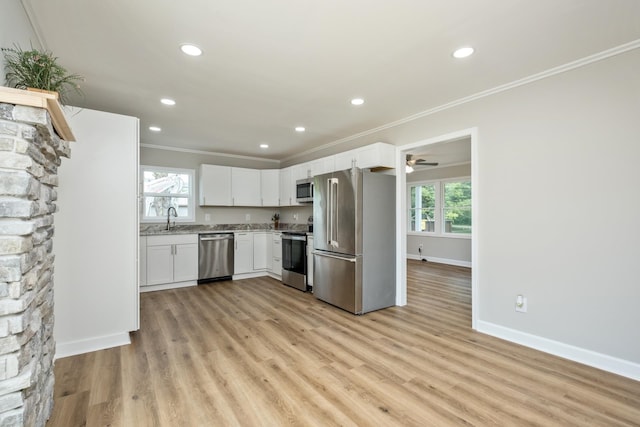 274 Dry Branch Rd, Churchville, VA 24421 - kitchen with appliances with stainless steel finishes, ornamental molding, white cabinets, healthy amount of natural light, and recessed lighting