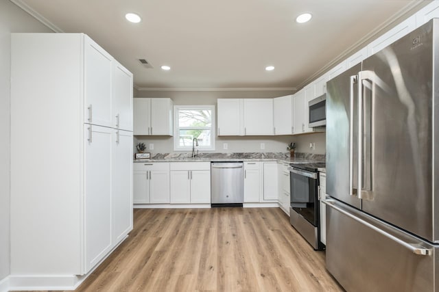 274 Dry Branch Rd, Churchville, VA 24421 - kitchen with appliances with stainless steel finishes, a sink, crown molding, light wood-style floors, and white cabinetry