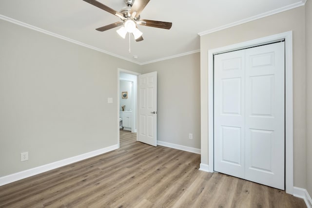 274 Dry Branch Rd, Churchville, VA 24421 - unfurnished bedroom with ornamental molding, light wood finished floors, baseboards, a closet, and ceiling fan