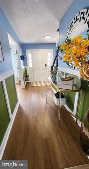 6603 Farmstead Ln, Fredericksburg, VA 22407 - entrance foyer with a textured ceiling, wood finished floors, healthy amount of natural light, and stairs
