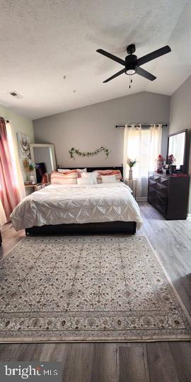 6603 Farmstead Ln, Fredericksburg, VA 22407 - bedroom with wood finished floors, lofted ceiling, and a ceiling fan