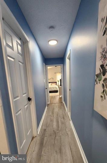 6603 Farmstead Ln, Fredericksburg, VA 22407 - corridor with wood finished floors and baseboards