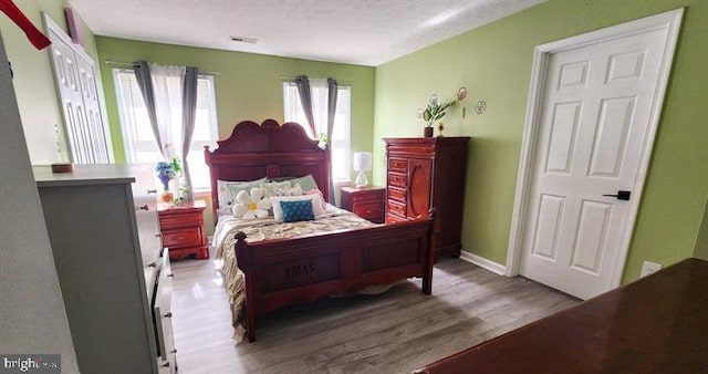 6603 Farmstead Ln, Fredericksburg, VA 22407 - bedroom with wood finished floors and baseboards
