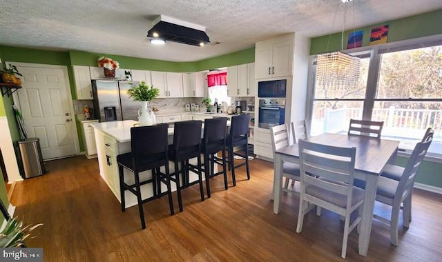 6603 Farmstead Ln, Fredericksburg, VA 22407 - kitchen featuring appliances with stainless steel finishes, a textured ceiling, a sink, white cabinets, and light countertops
