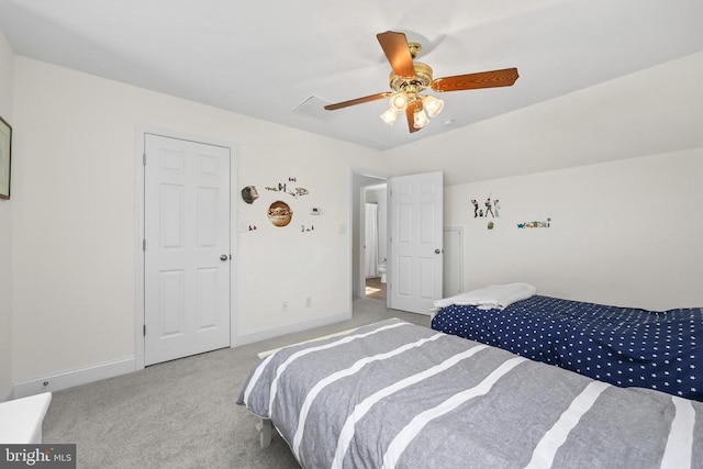 carpeted bedroom with baseboards and ceiling fan