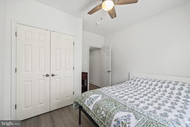 bedroom with wood finished floors, a closet, and a ceiling fan