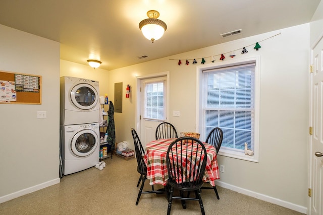2754 Maple Ave, Buena Vista, VA 24416 - dining room with baseboards, stacked washing maching and dryer, visible vents, and electric panel