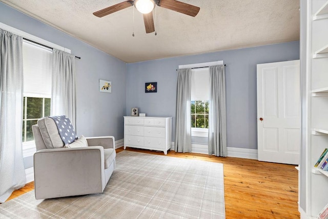 757 Entry School Rd, Waynesboro, VA 22980 - bedroom with wood finished floors, a textured ceiling, and a ceiling fan