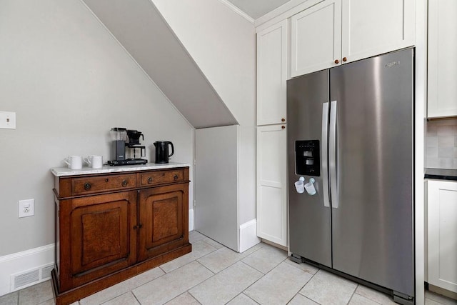 757 Entry School Rd, Waynesboro, VA 22980 - kitchen with stainless steel fridge with ice dispenser, white cabinets, and light tile patterned floors