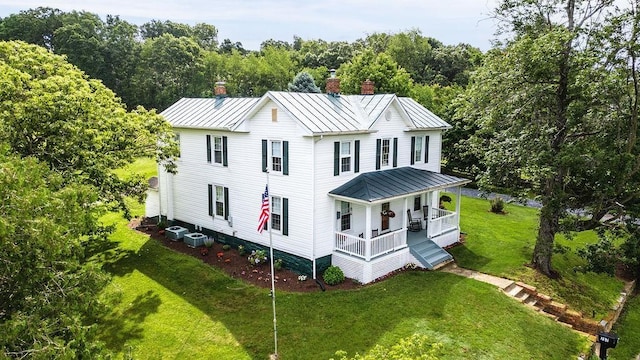 757 Entry School Rd, Waynesboro, VA 22980 - view of front of home with a standing seam roof, covered porch, a chimney, a metal roof, and a front lawn