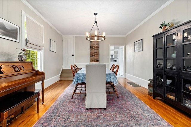 757 Entry School Rd, Waynesboro, VA 22980 - dining area with wood finished floors, ornamental molding, and a chandelier