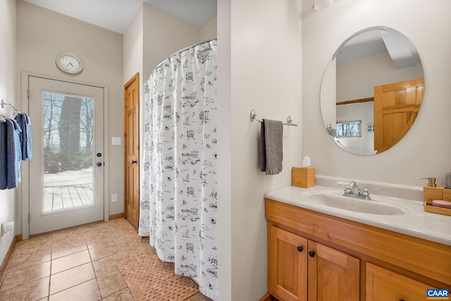full bathroom with baseboards, tile patterned flooring, vanity, and a shower with curtain