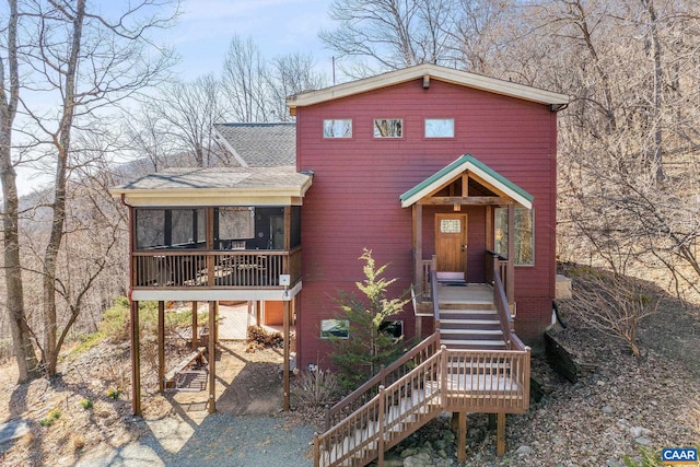 6696 Highlander Way, Crozet, VA 22932 - rustic home featuring stairway, a shingled roof, and a sunroom